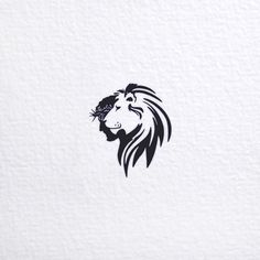 a lion's head is shown on the side of a white paper sheet with black ink