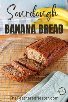 a loaf of gluten - free banana bread on a cooling rack with bananas in the background