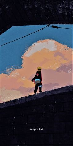 a man standing on top of a brick wall next to a sky filled with clouds