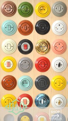 many different colored buttons are on the wall