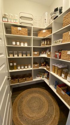 an organized pantry with baskets and other items