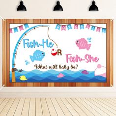 a fish themed baby shower is displayed on the wall in an empty room with wood flooring