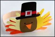 a paper turkey wearing a top hat and holding his hands out to the side,