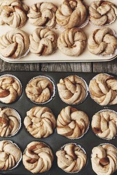 freshly baked cinnamon rolls sitting in muffin tins