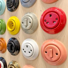 many different types of electrical plugs are arranged on the wall