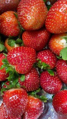 a pile of strawberries sitting on top of each other