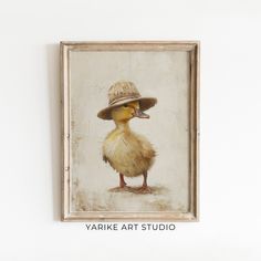 a painting of a duck with a hat on it's head and the words yarkke art studio above it