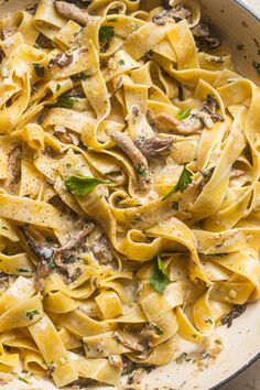 pasta with mushrooms and parsley in a skillet