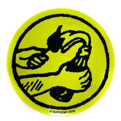 a yellow and black sticker with the image of a woman's face in a circle