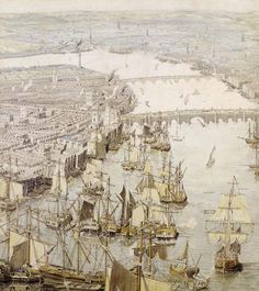 an aerial view of a city with ships in the water