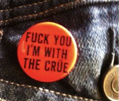 a button that says, i'm with the crue