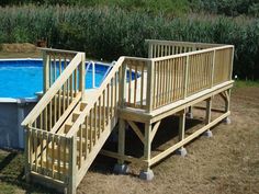 an above ground swimming pool with stairs leading up to the deck and above ground plunger