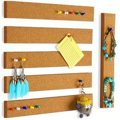 there is a cork board with earrings on it