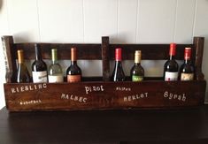 six bottles of wine in a wooden crate