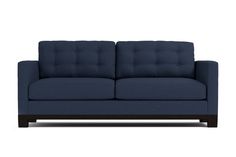 a blue couch sitting on top of a white floor