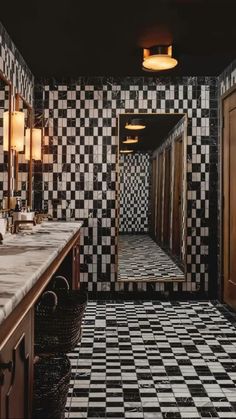 a bathroom with black and white checkered tile on the floor