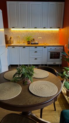 a table with place mats on it in a kitchen