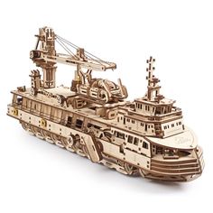 a wooden model of a ship on a white background