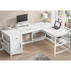 a white computer desk sitting on top of a hard wood floor next to a window