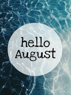 the words hello august are written in black on a white circle above blue ocean water