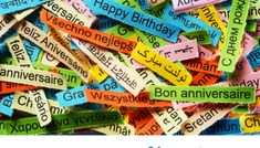 the words happy birthday written in many different languages on colorful strips of colored newspaper paper