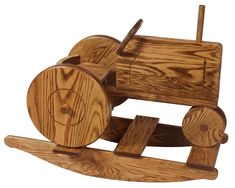 a wooden toy truck with wheels on it