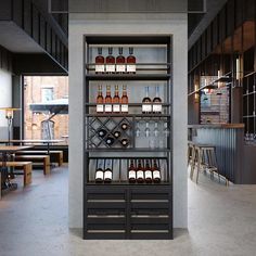 a wine rack in the middle of a room with tables and stools around it