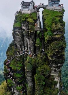 an image of people walking on the top of a mountain