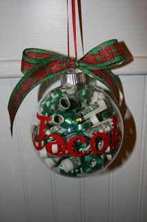 a christmas ornament hanging from a door decorated with dollar bills and the word good written on it