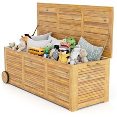 a wooden toy box filled with stuffed animals and other toys on top of a white background