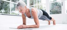 an older woman is doing push ups on her stomach