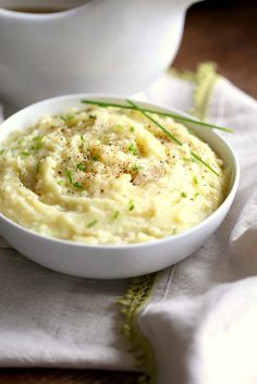 a bowl of mashed potatoes on a table