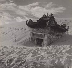 an old building is buried in the snow