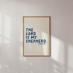 the lord is my shepherd print hanging on a wall in a room with white walls