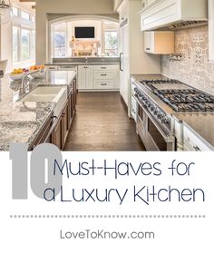 a large kitchen with white cabinets and marble counter tops is featured in the magazine must haves for a luxury kitchen