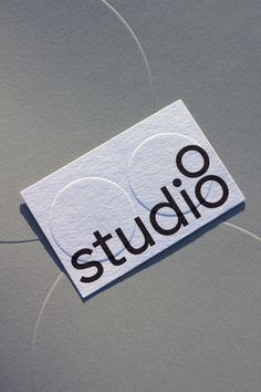 a white sticker with the word studio on it