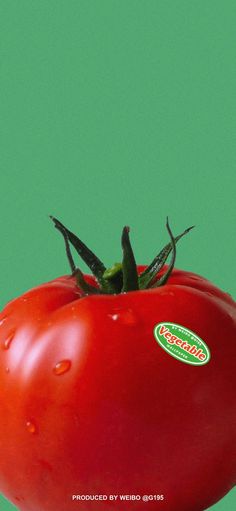 a red tomato with a green background