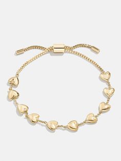 The Brittany Bracelet is the perfect way to add a subtle dose of affection to your curated wrist stack. This bracelet features petite heart adornments with chic negative space in between. Better yet, it's finished off with a pull-tie closure, meaning you'll always get the perfect fit. Every Jewels, Gold Charm Bracelets, Baublebar Bracelet, Preppy Jewelry, Jewelry Accessories Ideas, Dope Jewelry, Jewelry Essentials, Jewelry Lookbook, Classy Jewelry