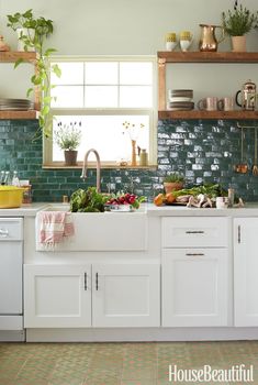 the instagram page on instagram shows an image of a kitchen with green tiles