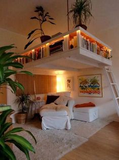 a loft bed with stairs leading up to the upper level and bookshelves above it