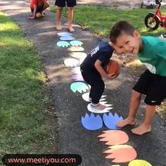 a young boy is playing with some paper circles