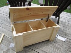 a wooden box sitting on top of a wooden deck