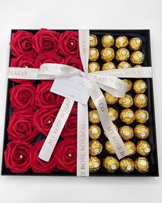 a box filled with red roses and chocolates