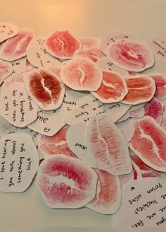 several pieces of paper that have been cut into hearts with words written on the side