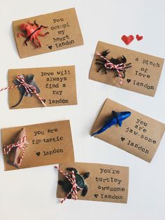 four handmade valentine's day cards on brown paper with red and white twine