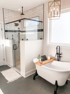 a white bath tub sitting next to a window