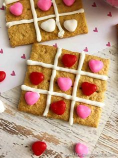 valentine's day cookies with marshmallows and hearts arranged on the top