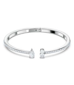 From Swarovski&#x2C; this bracelet features:Cuff BraceletAttract CollectionRhodium PlatedMetal / Crystal Hinge closureApprox. 2.25" x 1.875"Imported. Swarovski Heart Earrings, Silver Diamond Bracelet, Swarovski Jewelry Necklace, Crystal Cuff Bracelet, Swarovski Crystal Rings, Silver Bracelets For Women, Swarovski Bracelet, Swarovski Crystal Bracelet, Diamond Jewelry Necklace