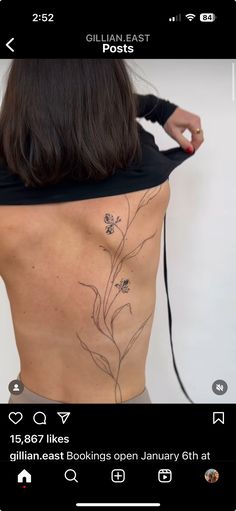 the back of a woman's body with flowers on it