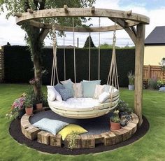 a swing bed in the middle of a yard